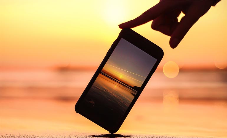 smart phone and sunset